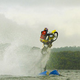 Illustration for article titled Skimming a Dirt Bike Over a Lake at 70MPH Then Flying Off a Jump Involves Confusing Physics